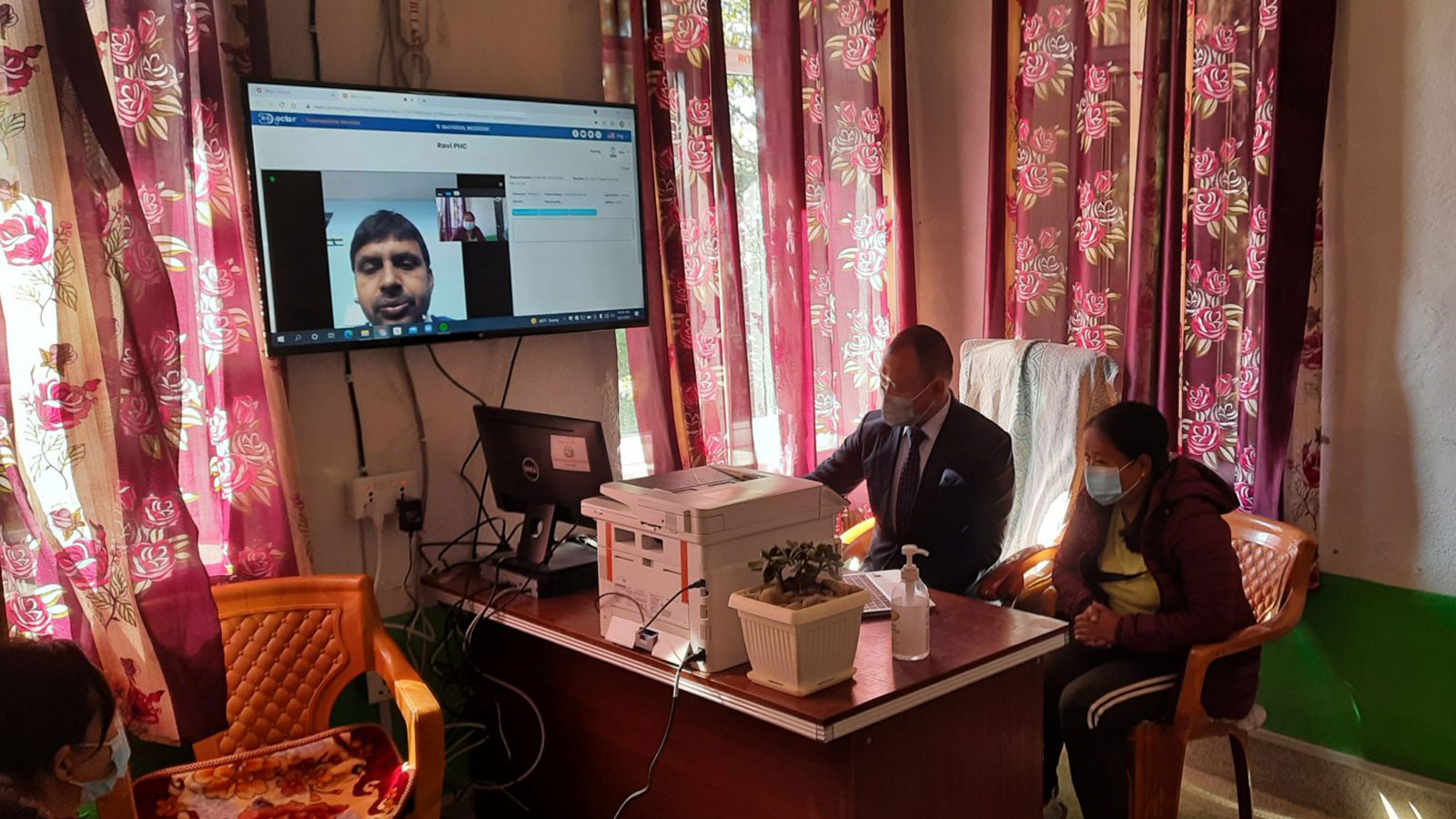 PV-powered Primary Health Centers (PHCs) linked with urban hospitals using Telemedicine: A local patient consulting an expert doctor by using the telemedicine facility, at the Rabi PHC, Miklajung, Panchthar. Copyright: GIZ/REEEP