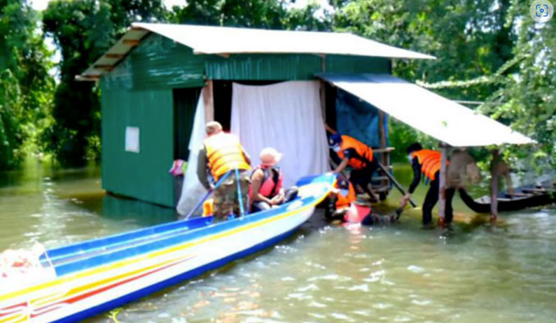 Figure 1: Officials in Cambodia evacuating residents from their flooded home